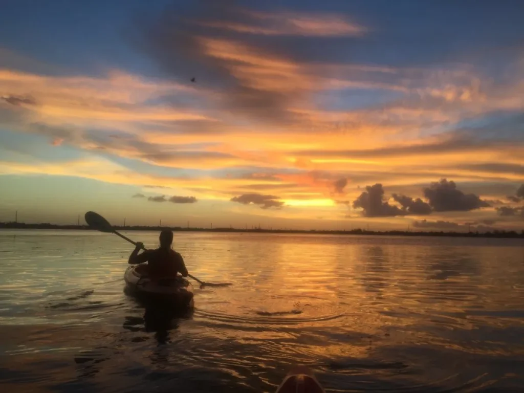 a kayak on the open water during the sunset