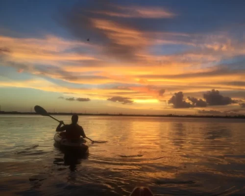 a kayak on the open water during the sunset